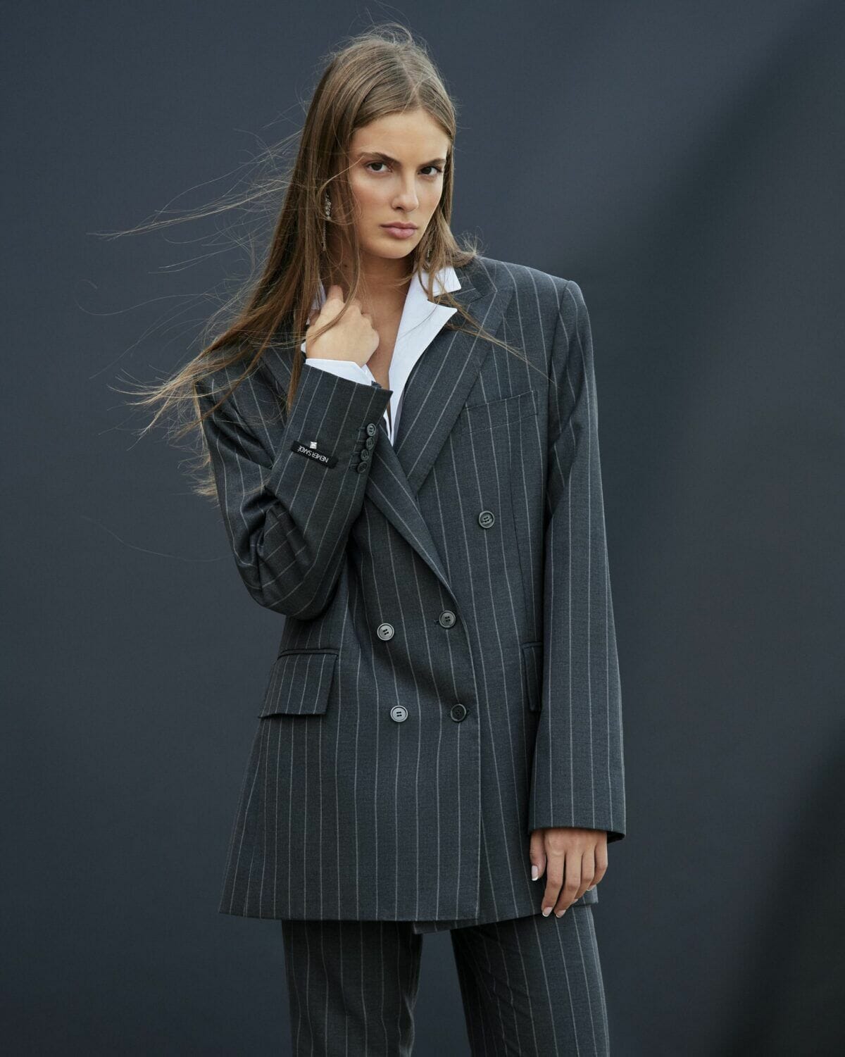 Loose double breasted pinstripe charcoal grey suit